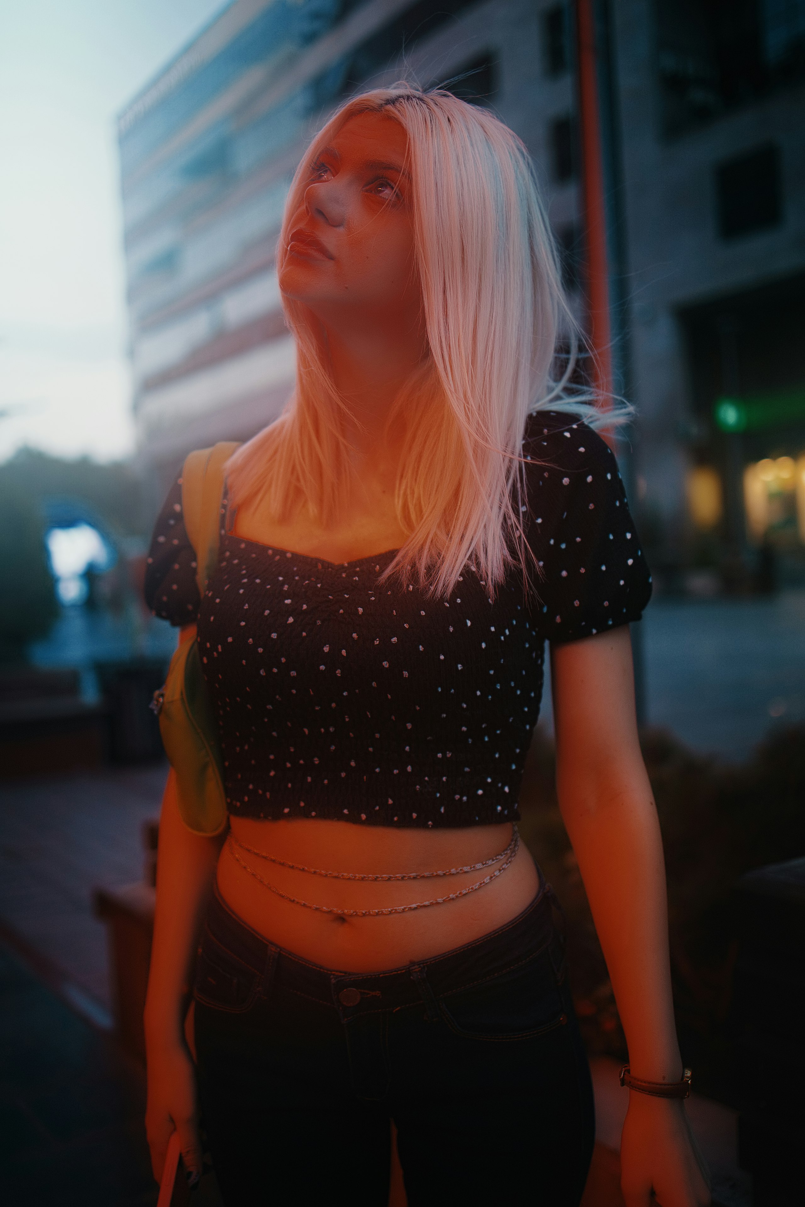 woman in black and white polka dot shirt and brown skirt